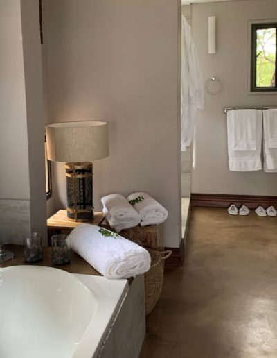 Luxury Bush Villa bath and entrance to shower and wash up area