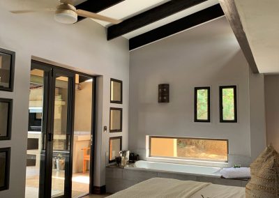 Luxury Bush Villa bedroom with view of bath