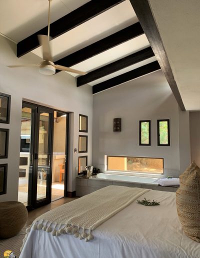 Luxury Bush Villa bedroom with view of bath