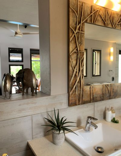 Luxury Bush Villa interior bathroom and view to outdoor area